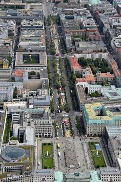 an aerial view of a city with lots of tall buildings