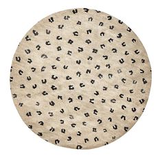 a round rug with black and white animal print on the bottom, in front of a white background