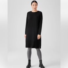 Nwt Eileen Fisher Stretch Jersey Knit Crew Neck Dress Boxy Fit, Calf Length Easy And Elevated. A Crew Neck Dress With Long Sleeves And Zippered Side Slits At The Hem. In A Body-Skimming Jersey Knit That Dresses Up Or Down. A Generous, Boxy Fit That Drapes Away From The Body To Create Movement. Tencel Lyocell Fiber Is Made From Responsibly Harvested Trees. We Design Our Line As A System Of Simple Shapes And Signature Fits So You Can Easily Find The Options That Work For You. Graphite Only Availab Long Sleeve Viscose Dresses For Loungewear, Black Viscose Long Sleeve Midi Dress, Black Long Sleeve Viscose Midi Dress, Black Longline Daywear Dress, Black Longline Dress For Daywear, Black Knee-length Dress With Side Slits, Longline Loungewear Dresses, Knee-length Black Dress For Layering, Fall Knee-length Dress With Side Slits