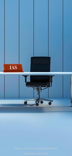 an office chair sitting in front of a desk with a sign that says ias