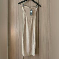 Brand New With Tags Size 2 Beige Beige Bodycon Midi Dress, Beige Bodycon Backless Dress, Backless Beige Bodycon Dress, Strapless Beige Bodycon Dress For Spring, Beige Backless Bodycon Dress, Beige Midi Bodycon Dress For Night Out, Strapless Beige Midi Dress For Party, Beige Stretch Strapless Dress, Beige Strapless Stretch Dress