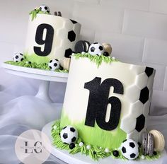 two cakes decorated with soccer balls and numbers on top of each cake, one is for the number nine