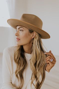 The hat that looks good with literally everything (which is why it's in almost all our photoshoots) and we can't get enough of it! Made with stiffened wool, Monroe is a bold statement piece with a classic fedora style. This rancher style hat's brim and crown are trimmed with tonal grosgrain ribbon and a slightly curled up brim.  Make any outfit look classy with a tip of the hat, Monroe is a hat you won't want to go anywhere without! Gigi Pip Brand Features an adjustable inner band Brim Hats For Women, Lifestyle Modeling, Monroe Hat, Platform Slip Ons, Nursing Friendly Tops, Fedora Style, Gigi Pip, Hat Styles, Wide Brim Hats