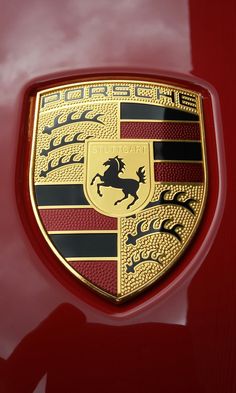 the emblem on the front of a red car