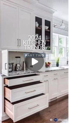 a kitchen with white cabinets and black counter tops in the center is an ad for part two