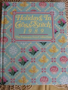 the front cover of a cross stitch book