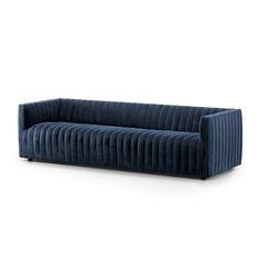 a blue velvet sofa on a white background