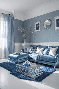 a living room filled with furniture and blue walls