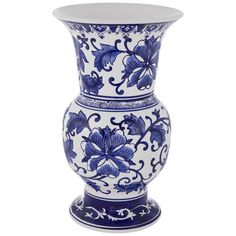 a blue and white vase with flowers on it