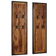 two wooden doors with hooks on them