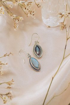 Ananda is a joyous pair of drop earrings, as light as feather. Featuring gorgeous rose cut Labradorite gemstones, nestled elegantly in a fine sterling silver frame, these earrings reflect the effortless beauty that comes from within. Labradorite: Reflections - Intentions - Prosperity Authentic Sivalya Labradorite Hallmarked Metal: 925 Sterling Silver Gemstone Size: 15mm x 8mm Cut: Marquise Rose Cut Stones Sterling Silver Marquise Earrings For Gift, Elegant Labradorite Teardrop Earrings, Elegant Labradorite Drop Earrings, Elegant Labradorite Dangle Earrings, Elegant Nickel-free Labradorite Earrings, Elegant Labradorite Jewelry For Pierced Ears, Elegant Teardrop Labradorite Earrings, Elegant Handmade Labradorite Earrings, Gemstone Labradorite Earrings