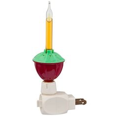 a light that is sitting on top of a white object with a yellow candle sticking out of it