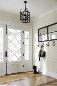 Cottage-Style Foyer Idea with Shiplap Wall, White Ceiling, and Wrought Iron Lantern Pendant Light Beadboard Ceiling, Plank Walls, Entrance Foyer, Cottage In The Woods, Lake Cottage, Ship Lap Walls