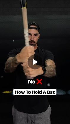 a man holding a baseball bat in his hand with the text no x how to hold a bat