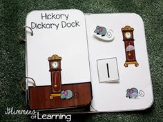 an open notebook with stickers on it and a clock in the middle that says hickory duck