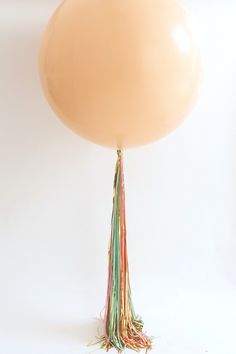 a large balloon with tassels on it