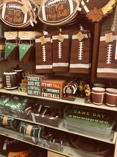 football themed party supplies are on display at the store's booth, including paper plates and cupcakes