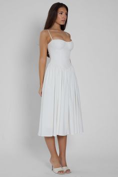 Introducing our Ballerina Bustier Midi Dress - a classic, feminine dress option for any occasion. From brunch parties to evening events, this white midi dress is complimented with wire bustier cups that skim down to a tight fit that cinches at the waistline. The skirt silhouette features a gathered detail that falls to a midi length making it an elegant dress meant to last in your wardrobe forever. Perfer mini length? Try our "Bellini Dress" - same style, just in mini length. Tight White Dress, White Tight Dresses, High Waist Long Skirt, White Midi, Long Skirt Outfits, Plain Dress, Bodycon Floral Dress, Bustier Dress, Feminine Dress