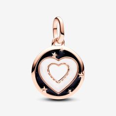 Radiate love with the Pandora ME Hearts Medallion Charm in 14k rose gold plating. This modern amulet features a cut-out heart at the centre, surrounded by a heart-shaped bioresin man-made mother of pearl frame. Around the heart is glittery black enamel sprinkled with raised stars, and the reverse side is detailed with radiating microbeaded lines. This medallion charm can be styled on Pandora Moments charm holders and openable links on Pandora ME carriers. - Pandora ME Hearts Medallion Charm - En Pearl Frame, Pandora Me, Radiate Love, Charms Pandora, Charm Holder, Pandora Bracelet Charms, Mesh Bracelet, Dangle Charms, Bracelets And Charms