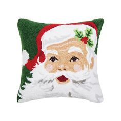 a christmas pillow with santa clause on it