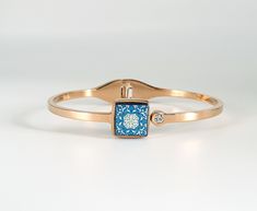 Rose GOLD and Blue Tile Bangle Bracelet Handmade with Stainless Steel and Cubic Zirconia stone. This bracelet made with Portuguese Tiles Pattern that makes a beautiful portuguese tile jewelry gift suggestion, for anniversaries, birthday's, mother's day, Christmas gift giving or any other special occasion. Lightweight but catchy, suitable for summer and sunny days. Winter days are great to wear them too. Just avoid water, lotions, perfumes or makeup, due to the nature of the handmade work 😊 ⭐ Dimensions: - 6 cm diameter wide, or almost 2.4'' inches ⭐ Main Features: * Featured Original Jewelry * Rose Gold Sturdy Stainless steel * Unique patterns and designs * Anti allergic * Lightweight * Perfect with other stacking bracelets * Opens and closes really easily * Durable * Ethical Jewelry ⭐ If Rose Gold Plated Bangle, Rose Gold Plated Bangle As A Gift, Tile Jewelry, Tiles Pattern, Portuguese Tile, Tile Ceramic, Small Tiles, Portuguese Tiles, Blue Tile