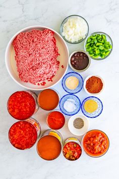 the ingredients are laid out in bowls to be used as an appetizer for meatballs