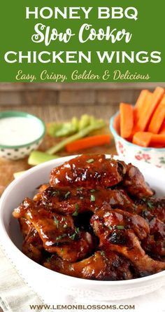 honey bbq slow cooker chicken wings in a bowl with carrots and celery