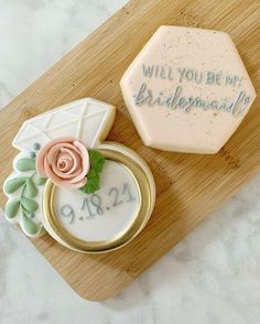 a decorated cookie with the words will you be my bridesmaid written on it