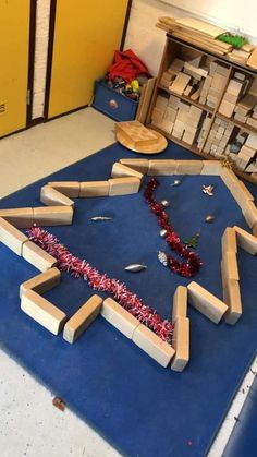 a room that has some kind of cardboard structure on the floor in front of it