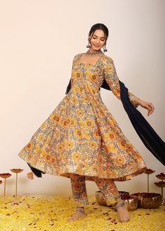 *The Anarkali kurta, crafted from soft and breathable cotton, features full sleeves and a square neckline for timeless elegance.  *Fitted at the bust, it accentuates your natural silhouette, creating a flattering and comfortable wear that accompanies you throughout the day.  *This delightful set doesn't stop at just the kurta. It includes a matching pant, offering a coordinated ensemble that combines style and practicality seamlessly.  *The sunshine yellow and multi-colored floral print breathe Yellow Floral Print Anarkali Set With Straight Kurta, Yellow Floor-length Anarkali Set For Transitional Season, Unstitched Yellow Anarkali Set With Floral Print, Yellow Floral Embroidery Semi-stitched Anarkali Set, Yellow Floral Embroidered Semi-stitched Anarkali Set, Floral Anarkali, Anarkali Kurta, Anarkali Gown, Anarkali Suit