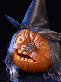 a halloween pumpkin with a witch's hat on its head and long gray hair