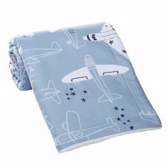 a blue tie with airplanes and stars on it