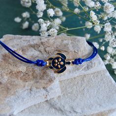 MantraBand Turtle Thread Bracelet in Blue Blue Adjustable Cord Bracelet As A Gift, Blue Adjustable Cord Bracelet Gift, Blue Jewelry With Adjustable Cord For Beach, Adjustable Blue Jewelry For Beach, Adjustable Blue Beach Jewelry, Blue Adjustable Bracelet Jewelry, Adjustable Nickel Free Blue Jewelry, Blue Adjustable Jewelry As A Gift, Adjustable Nickel-free Blue Jewelry