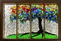 a stained glass window with a tree on it