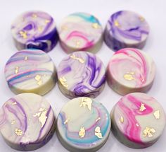 marble soaps with gold flecks on them are arranged in the shape of hearts