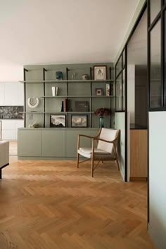 a living room filled with furniture and wooden floors