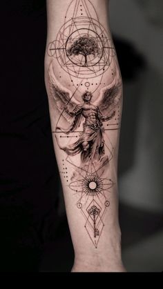 a person's leg with tattoos on it and an angel in the middle, surrounded by other symbols