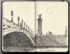 an open notebook with a drawing of a bridge and the moon in the sky above it