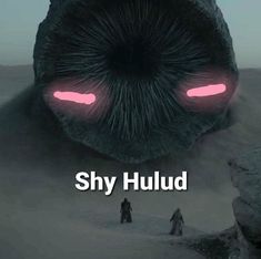 a giant creature with glowing eyes and two people standing in front of it that says, shy huld