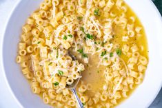 a white bowl filled with macaroni and cheese soup