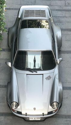 an overhead view of a silver sports car