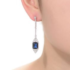 Dazzling with blue and white cubic zirconia gemstones, these sterling silver drop earrings lend an elegant touch to your wardrobe. Dazzling with blue and white cubic zirconia gemstones, these sterling silver drop earrings lend an elegant touch to your wardrobe. Length: 53 mm Backings: post Metal: sterling silver Plating: rhodium Finish: polished Packaging: boxedSTONE DETAILS Stone type: cubic zirconia Total weight: 9 5/8 ct. Shape: baguette cut, emerald cut, round Setting: bezel, prong Gemstones Blue Cubic Zirconia Diamond Earrings For Formal Events, Blue Diamond Drop Earrings For Anniversary, Formal Sapphire Cubic Zirconia Diamond Earrings, Blue Diamond Drop Earrings For Formal Occasions, Elegant Blue Earrings With Diamond Accents, Blue Cubic Zirconia Diamond Earrings For Wedding, Elegant Blue Diamond Earrings In Sterling Silver, Classic Blue Diamond Drop Earrings, Elegant Blue Diamond Dangle Earrings