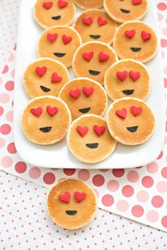 heart shaped pancakes are arranged on a plate