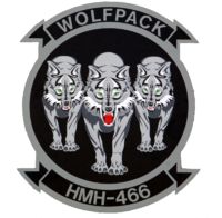 the wolfpack logo is shown in black and white, with three cubs on it