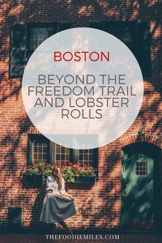 a woman standing in front of a brick building with the words boston beyond the reddom trail and lobster rolls