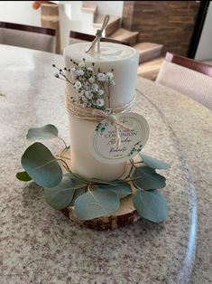 a candle is sitting on top of a piece of wood