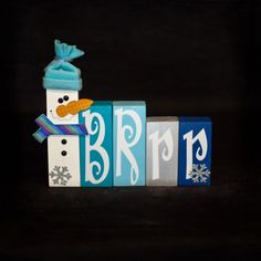 a snowman made out of blocks with the word brrr spelled in it's letters