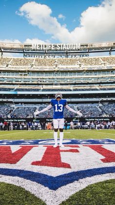 a football player stands on the field at metlife stadium