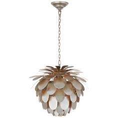 a chandelier hanging from the ceiling with white and brown leaves on it's petals