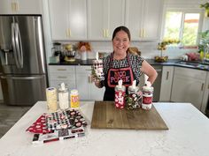 a woman is standing in the kitchen with some condiments